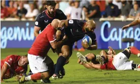  ?? Martin Dokoupil/World Rugby/Getty Images ?? Paul Lasike of USA is tackled during the game against Portugal in Dubai. Photograph: