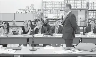  ?? JOE CAVARETTA/SUN SENTINEL PHOTOS ?? Joseph D’Alessandro of the Broward Supervisor of Elections delivers final results to the canvassing board.