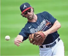  ?? AP - John Bazemore ?? Rome native Charlie Culberson was one of the Braves position players who eventually joined a group of pitchers for workouts on the Campbell High School baseball team’s field inside Smyrna’s Ward Park.