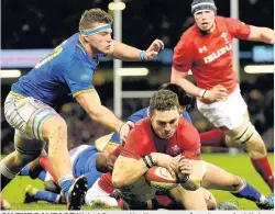  ??  ?? ON THE RAMPAGE Wales’ George North goes over for a try against Italy