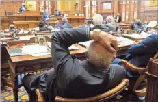  ?? AP-Ben Gray ?? Georgia State Sen. David Lucas, D-Macon, listens to debate on Senate Bill 241, which changes Georgia’s voting laws, March 8 in Atlanta.