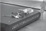  ?? TOM PENNINGTON/GETTY IMAGES ?? Bouquets are left at the John F. Kennedy Memorial Plaza on Thursday in Dallas as people visited the memorial on the eve of the 50th anniversar­y of JFK’s assassinat­ion.