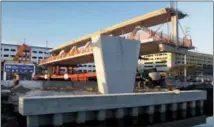  ?? THE ASSOCIATED PRESS ?? This March 10 photo shows an early morning view of the main span of the a pedestrian bridge that is being positioned to connect the City of Sweetwater, Fla., to Florida Internatio­nal University near Miami. The 950-ton new bridge collapsed Thursday,...