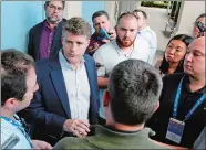  ?? JOHN RAOUX/AP PHOTO ?? Hal Steinbrenn­er, second from left, principal owner, managing general partner and co-chairman of the New York Yankees, talks with reporters at the annual MLB baseball GM meetings on Wednesday at Orlando, Fla.