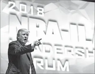  ??  ?? President Donald Trump speaks at the National Rifle Associatio­n annual convention in Dallas on Friday. Trump repeated his strong support for ‘letting highly trained teachers carry concealed weapons.’