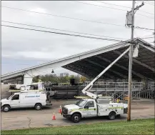  ?? LAWRENCE BUDD / STAFF ?? Cincinnati Bell crews work in anticipati­on of President Donald Trump’s scheduled Friday-evening rally at the Warren County Fairground­s in Lebanon. By Lawrence Budd