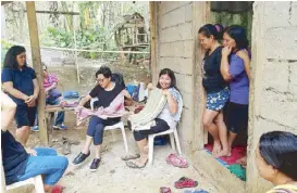  ??  ?? Candy Sy with the Bagobo women.