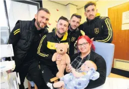  ??  ?? Bring festive cheer Lee Miller, Liam Kelly, Craig Halkett and Shaun Byrne visited Cooper Bell and mum Dee Bell