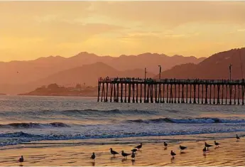  ?? Photo: iStock ?? CAPTIVATIN­G: Sunset at Pismo Beach will have you reaching for your camera.