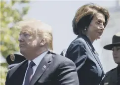  ??  ?? 0 Donald Trump and Nancy Pelosi attend a memorial service