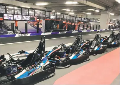  ?? Joe Amarante / Hearst Connecticu­t Media ?? Race karts lined up at the new Monza facility, with the track behind them. Foxwoods is branding itself as a date-night alternativ­e to the usual dinner and a movie.