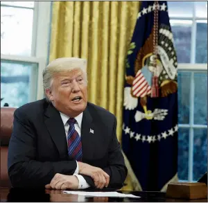  ?? AP/EVAN VUCCI ?? President Donald Trump, joined on the phone by Mexican President Enrique Pena Nieto, announces the trade agreement Monday in the Oval Office of the White House.