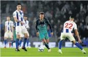  ?? Picture: GETTY IMAGES/DAN ISTITENE ?? SKILLED: Dele Alli of Tottenham Hotspur runs with the ball past Lewis Dunk and Martin Montoya of Brighton &amp; Hove Albion during their Premier League match at American Express Community Stadium in Brighton on Saturday.