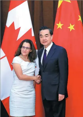  ?? WU HONG / REUTERS ?? Foreign Minister Wang Yi and Canadian Foreign Minister Chrystia Freeland, at the Ministry of Foreign Affairs office in Beijing on Wednesday, discussed areas of agreement.