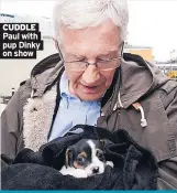  ??  ?? CUDDLE Paul with pup Dinky on show