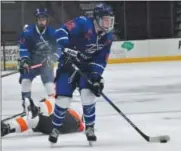  ?? JON BEHM — THE MORNING JOURNAL ?? Bay’s Jake Gaudino looks for an opening to shoot during the first period against North Olmsted on Dec. 22 at The Q. Gaudino had four goals in the Rockets’ loss.