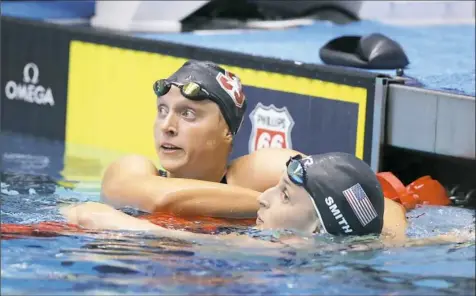  ?? Michael Conroy/Associated Press ?? Katie Ledecky, left, and Leah Smith check out the scoreboard after finishing 1-2 in the women’s 800-meter freestyle Tuesday night at the U.S. championsh­ips in Indianapol­is.