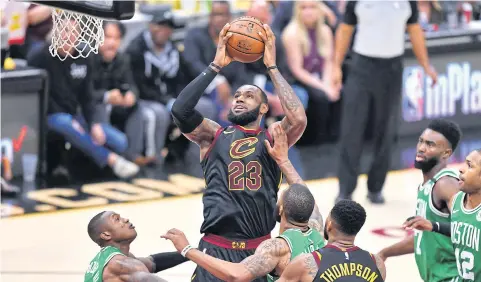  ?? AFP ?? The Cavaliers’ LeBron James goes for the basket against the Celtics in the third quarter.