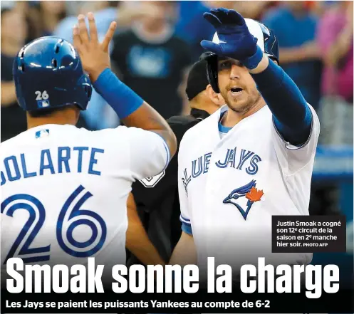  ?? PHOTO AFP ?? Justin Smoak a cogné son 12e circuit de la saison en 2e manche hier soir.