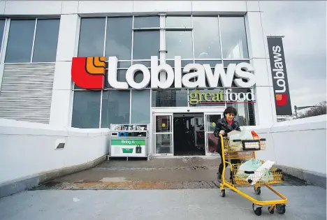  ?? NATHAN DENETTE/ THE CANADIAN PRESS ?? Loblaw Companies Ltd. is preparing for a “very difficult year” in 2018. It is closing 22 unprofitab­le stores while doubling down on its e- commerce offerings, including launching home delivery in Toronto starting Dec. 6 and Vancouver starting January...