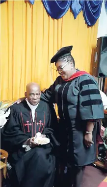  ??  ?? Apostle Bishop Dr Karen Reid-Hyman shares a moment with Bishop Dr Boyse Chaplin of the Glad Tidings Institute in Florida after receiving her bachelor’s degree.