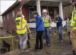  ?? LUCY SCHALY — PITTSBURGH POST-GAZETTE VIA AP ?? Ohio EPA officials, including director Anne Vogel, left, took a tour Thursday of the damage from last week's freight train derailment in East Palestine, Ohio.