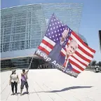  ?? WIN MCNAMEE/ GETTY IMAGES ?? Trump supporters gather outside the BOK Center, site of President Trump’s rally Saturday.