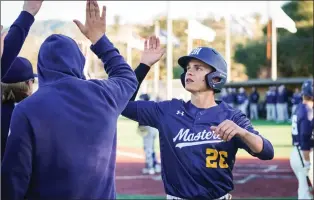  ?? Coutesy TMU Athletics ?? TMU baseball’s Pearson Good high-fives a teammate in a game earlier this season.