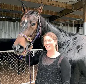  ?? JAMIE SEARLE/STUFF ?? Trainer Sophie Price with Silent Battler after their win at Ascot Park on Sunday.