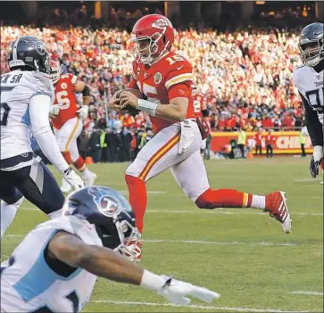  ?? David Eulitt Getty Images ?? KANSAS CITY Chiefs quarterbac­k Patrick Mahomes runs for a 27-yard touchdown against the Tennessee Titans in the AFC championsh­ip game. Mahomes also passed for three touchdowns in the Chiefs’ 35-24 win.