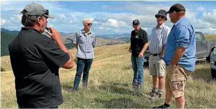  ??  ?? Federated Farmers President Andrew Hoggard (right) and local farmer Hamish Cave talk to Feds Gisborne-Wairoa executive members (from left) Charlie Reynolds, Richard Briant and provincial president Toby Williams on issues to do with forestry sprouting up on the hill ranges in the background.