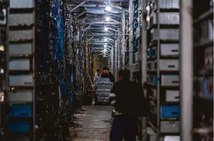  ?? AFP via Getty Images ?? Until two months ago, cryptocurr­ency mining mainly occurred at farms like this one in China seen in March.