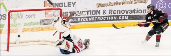  ?? ?? Tami Quan Photograph­y
Rylee Hlusiak scores the winning shootout goal on Merritt goalie Johnny Hicks in a BC Hockey League game on Wednesday. The West Kelowna Warriors won that game, but lost a pair on the weekend.