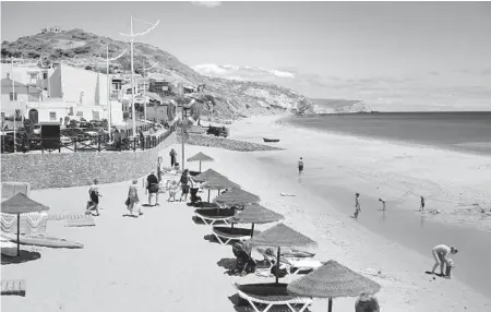  ?? RICK STEVES’ EUROPE ?? Salema’s fishermen share their beach with travelers.