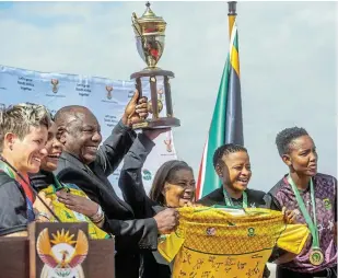  ?? GALLO IMAGES/ALET PRETORIUS Picture: ?? WAFCON CHAMPS: South African President Cyril Ramaphosa with the WAFCON trophy at his meeting with Banyana Banyana at Union Buildings on July 27 in Pretoria after the SA women’s soccer team won the 2022 WAFCON finals by beating Morocco 2-1 at the Prince Moulay Abdellah Stadium in Morocco