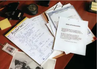  ??  ?? Documents from Anderson’s case on public defender Kelley Kulick’s desk