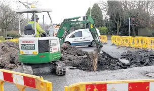  ??  ?? ●●Work on the burst water main on Dean Lane/Jackson’s Lane, Bramhall