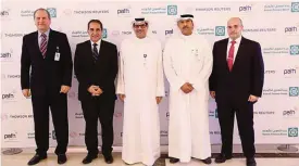  ??  ?? KFH-Group CEO Mazin Saad Al-Nahedh, KFH Officials and Officials from Path Solutions and Reuters