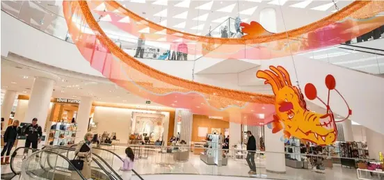  ?? LIANG SEN/XINHUA ?? Dragon takes flight Dragon-themed decoration is seen inside a shopping mall in Vancouver, British Columbia, Canada. Retail establishm­ents are adorning their spaces with themed decoration­s in anticipati­on of the Chinese Lunar New Year of the Dragon.