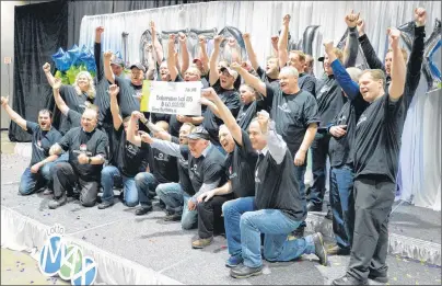  ?? THE CANADIAN PRESS/KEITH GOSSE ?? Thirty-one members of the Boilermake­rs Local 203 at the North Atlantic oil refinery in Come By Chance, N.L., collected their shares of a $60-million Lotto Max jackpot Wednesday in St. John’s. Each member of the winning group collected a cheque for...