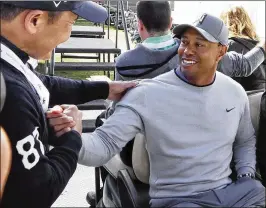  ?? REED SAXON/ ASSOCIATED PRESS ?? Tiger Woods greets a well-wisher at Riviera Country Club, where he will compete against players he has helped during his absences from golf.