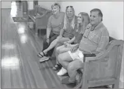  ?? Olivia Morley ?? Chief Magistrate Judge Gene Richardson and his family — Beverly, Raya and Elisa — wait in the Floyd County Administra­tion Building on Wednesday afternoon for the results of absentee ballots which were still being processed. Richardson is seeking reelection to that post.