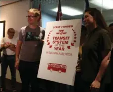  ?? BEN SPURR/TORONTO STAR ?? Activists with TTCriders present the transit agency with a mock award for being North America’s "least funded transit system."