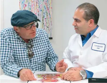  ??  ?? Below: Dr. Allen Kamrava (right), Cedars-Sinai Medical Center, Los Angeles with a patient