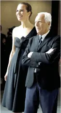  ??  ?? ITALIAN DESIGNER Giorgio Armani (R) poses with
his niece Roberta during photo call before his fashion show to celebrate the 40th anniversar­y of
his career on April 30.