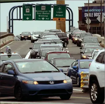  ?? JIM MAHONEY — BOSTON HERALD ?? Traffic waits to merge into the Sumner Tunnel from McClellan Highway on April 12, 2019 in Boston, Massachuse­tts Many truck drivers who wish to avoid McClellan traffic use the streets of East Boston