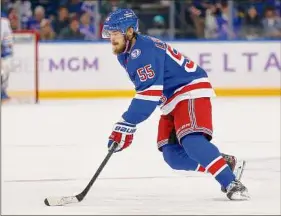  ?? John Munson / Associated Press ?? New York’s Ryan Lindgren drove the net and tapped in a pass from Mika Zibanejad with 0.4 seconds showing on the clock, rescuing the Rangers.