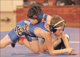  ?? Scott Herpst ?? Rossville’s Rylan Ball tries to flip Trion’s Ashton Jordan during a bout last week at the Rossville Athletic Center. Results of the matches were not available as of press time.