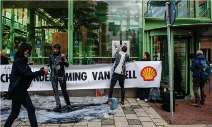  ?? Photograph: Ana Fernandez/SOPAImages/Rex/Shuttersto­ck ?? Climate activists protest against Shell in The Hague in October.