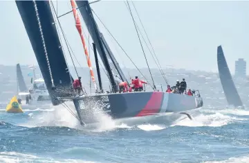  ??  ?? Scallywag sails out of Sydney Harbour at the start of the Sydney to Hobart yacht race. — AFP photo